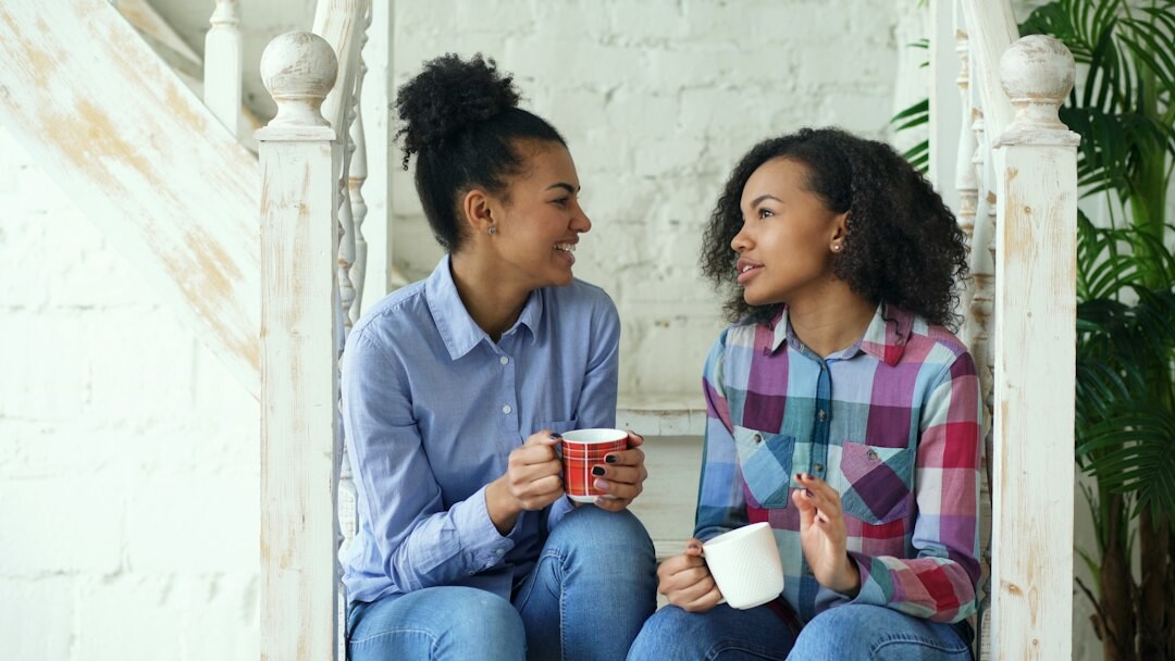 Two women having a warm conversation over coffee