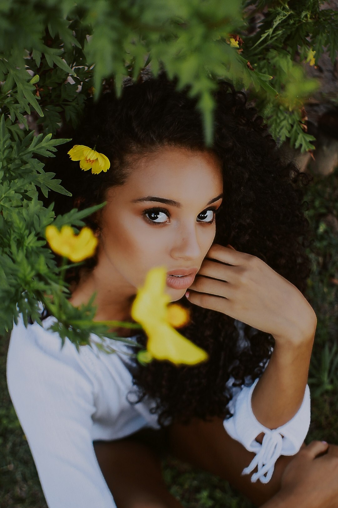 Portrait of a smiling Brazilian woman with curly hair