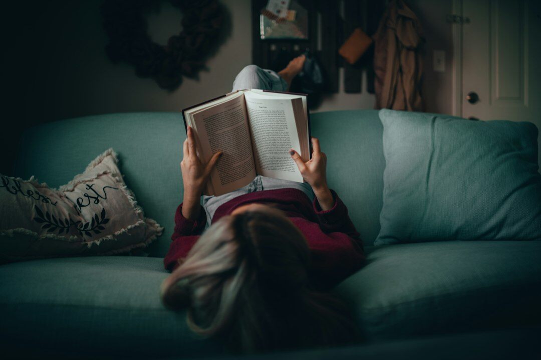 person reading self help book